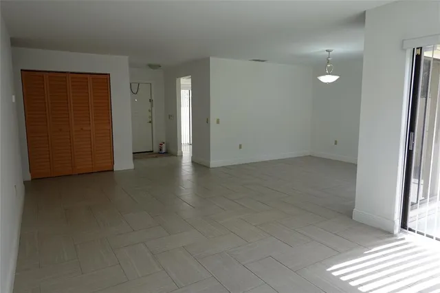 an empty room with closet area