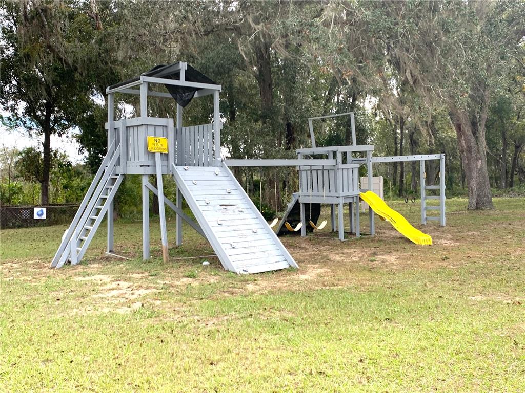 15991 Northeast 243rd Place Road, Unit 54 Fort McCoy, FL 32134 - Photo 4 of 4 a view of a swimming pool with a deck