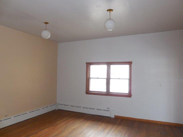 901 South Westgate Road Des Plaines, IL 60016 - Photo 11 of 21 an empty room with wooden floor and windows