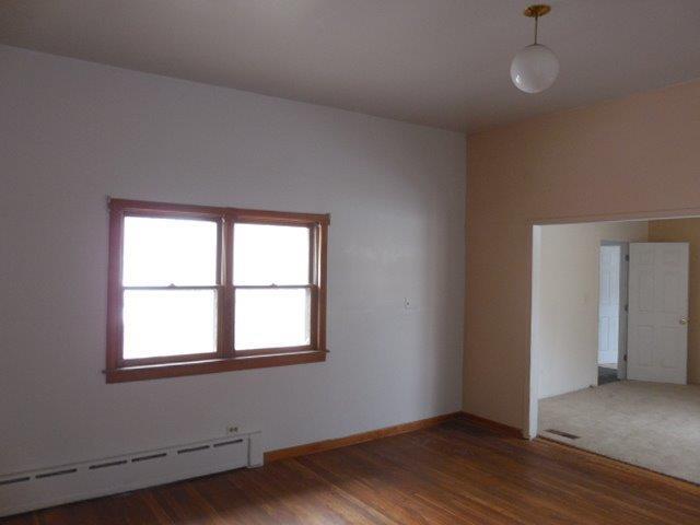 901 South Westgate Road Des Plaines, IL 60016 - Photo 12 of 21 an empty room with wooden floor and windows