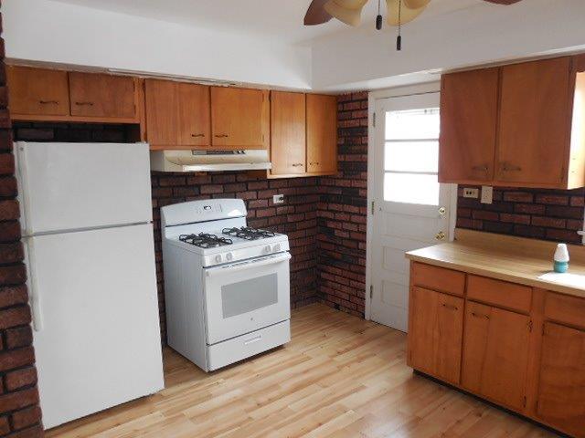 901 South Westgate Road Des Plaines, IL 60016 - Photo 8 of 21 a kitchen with a stove cabinets and a refrigerator