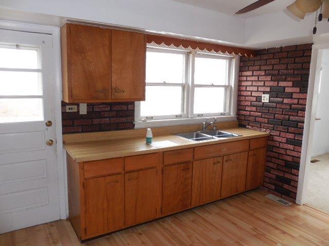 901 South Westgate Road Des Plaines, IL 60016 - Photo 9 of 21 a kitchen with a sink and cabinets