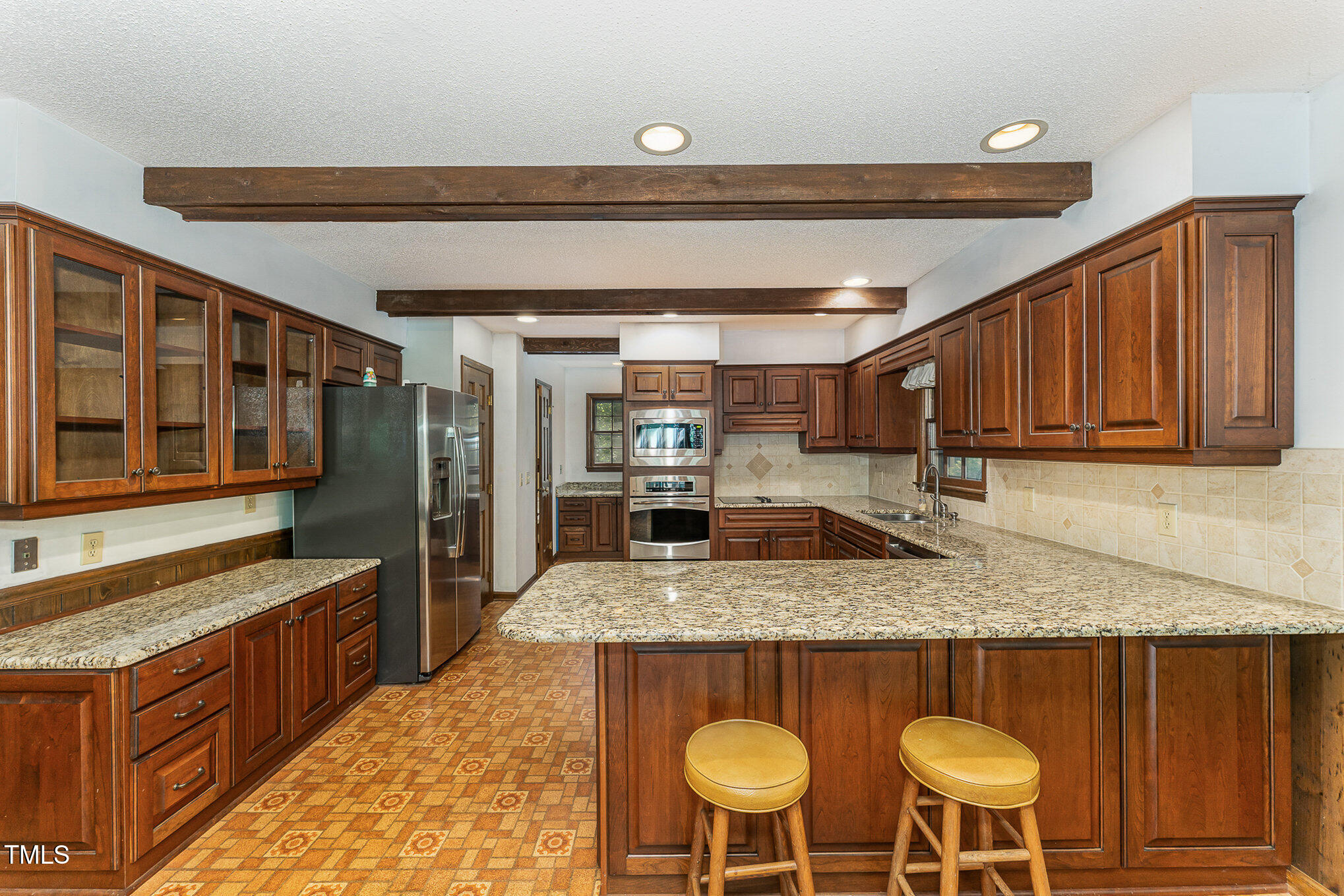 8409 Crowder Road Raleigh, NC 27603 - Photo 12 of 44 Granite Counters. Glass Cabinets.