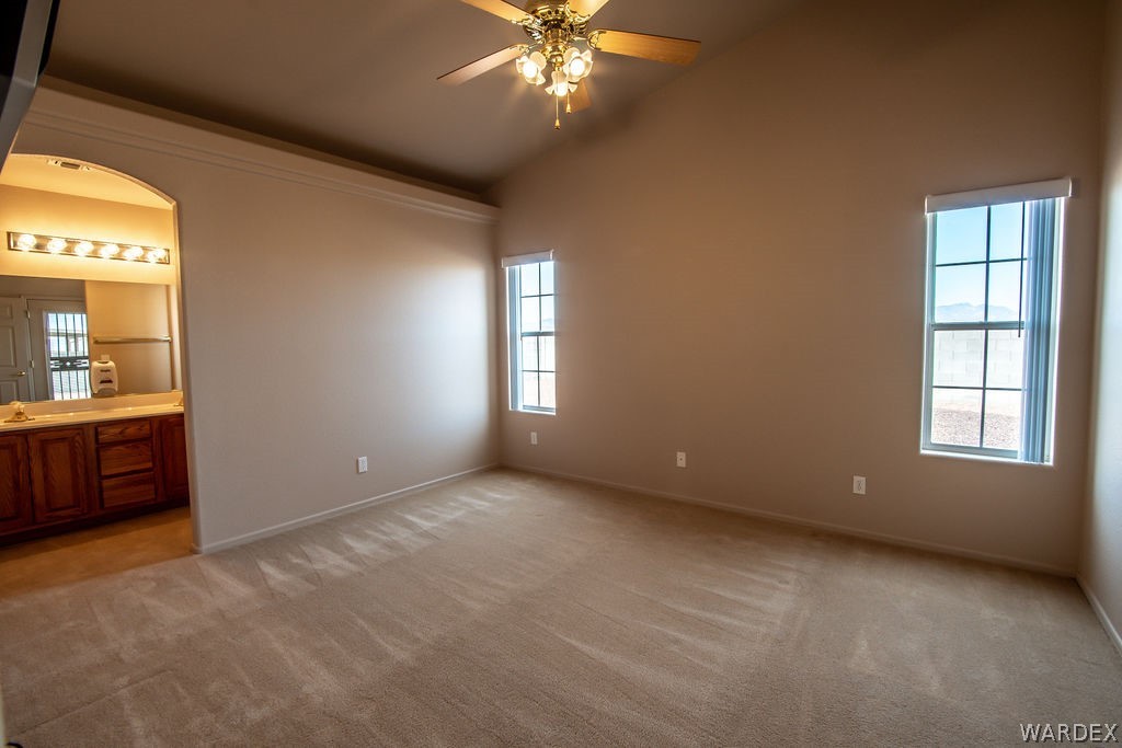 4213 East Cane Ranch Road Kingman, AZ 86401 - Photo 11 of 40 a view of an empty room with a window