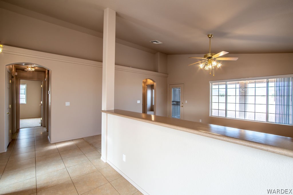 4213 East Cane Ranch Road Kingman, AZ 86401 - Photo 7 of 40 a view of a hallway with a chandelier and livingroom view