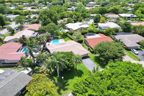 an aerial view of residential house with outdoor space and street view