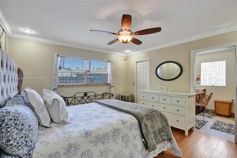 a bedroom with a bed and a table in it