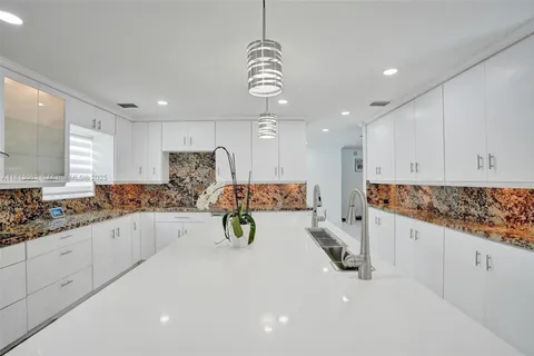 a view of a chairs and table in backyard