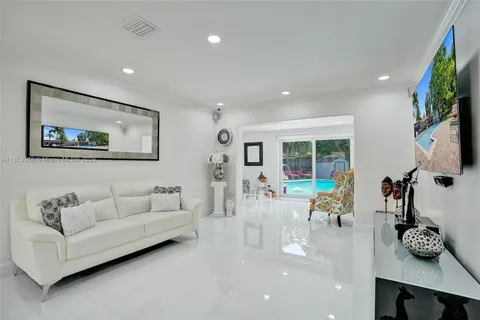 a kitchen with stainless steel appliances kitchen island granite countertop a sink and cabinets