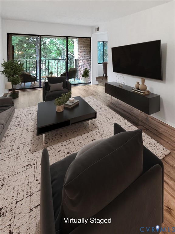 a living room with furniture and a flat screen tv