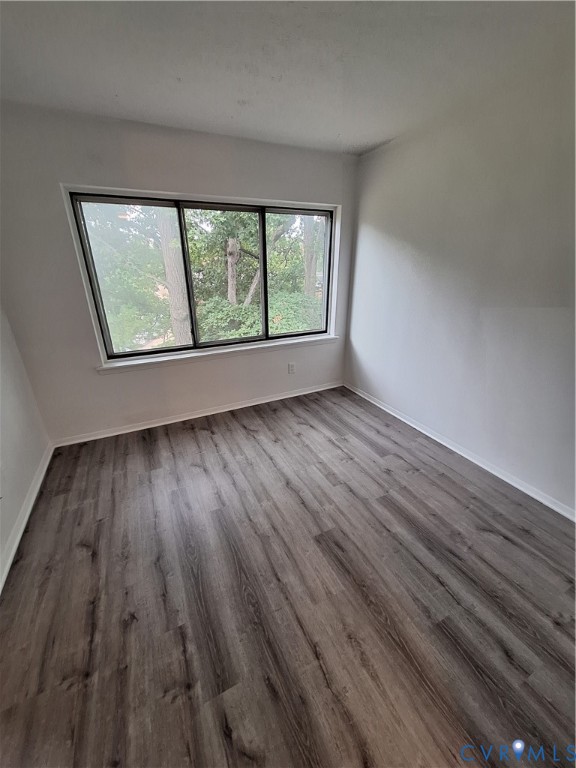 1501 Regency Woods Road, Unit 303 Henrico, VA 23238 - Photo 13 of 24 wooden floor in an empty room with a window