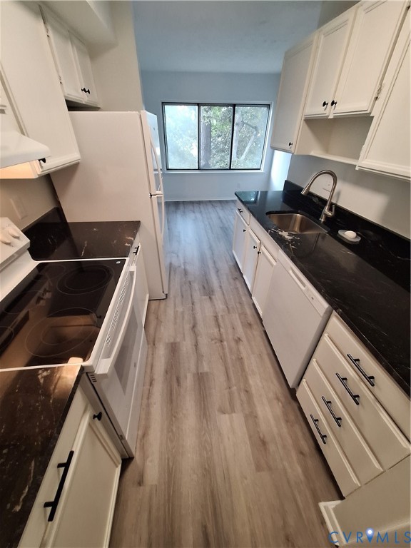1501 Regency Woods Road, Unit 303 Henrico, VA 23238 - Photo 3 of 24 a kitchen with wooden cabinets and a stove top oven