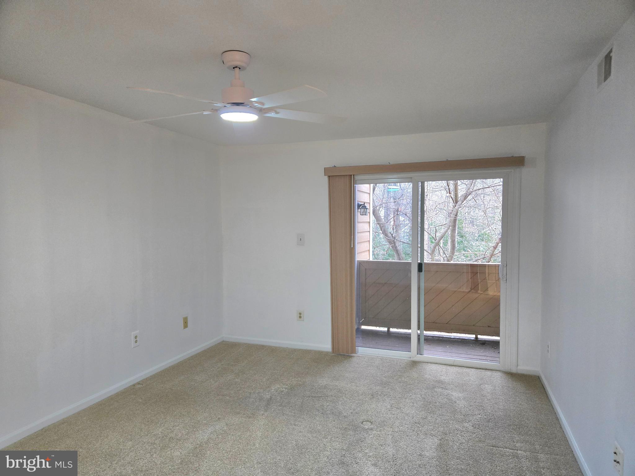 1537 Church Hill Place, Unit 1537 Reston, VA 20194 - Photo 10 of 40 a view of an empty room with a window