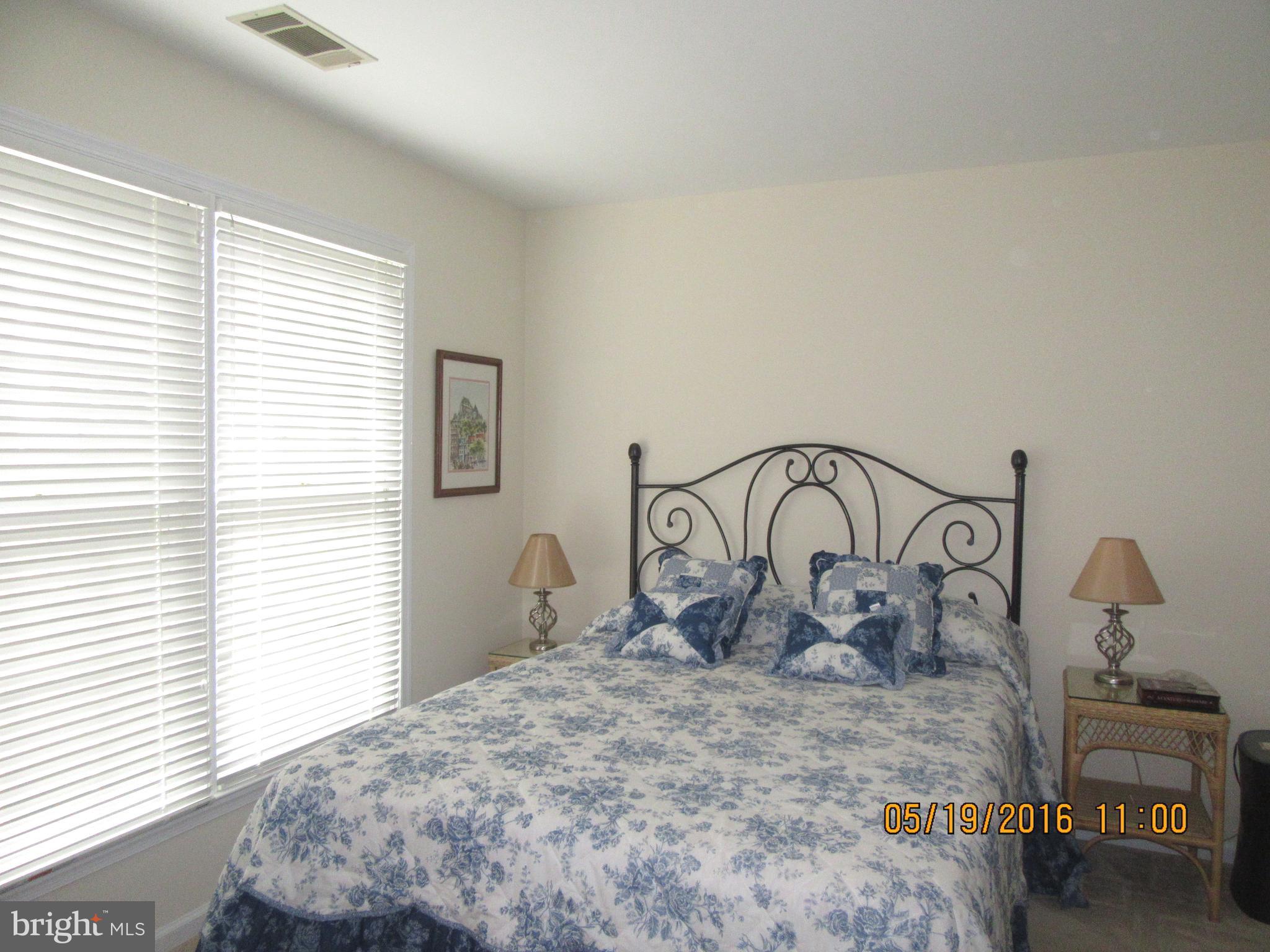 1537 Church Hill Place, Unit 1537 Reston, VA 20194 - Photo 16 of 40 a bedroom with bed and a window