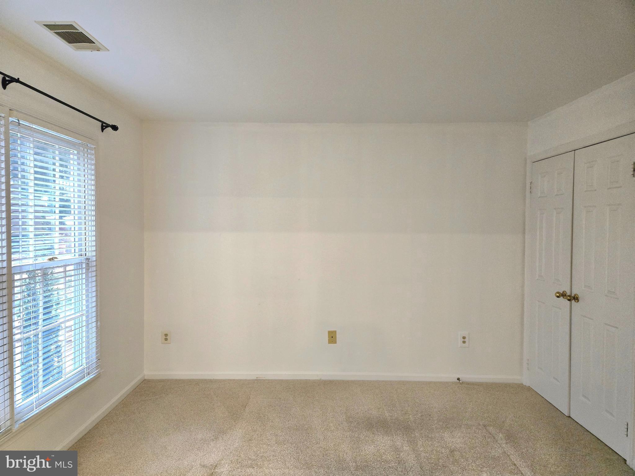 1537 Church Hill Place, Unit 1537 Reston, VA 20194 - Photo 17 of 40 a view of an empty room with a window