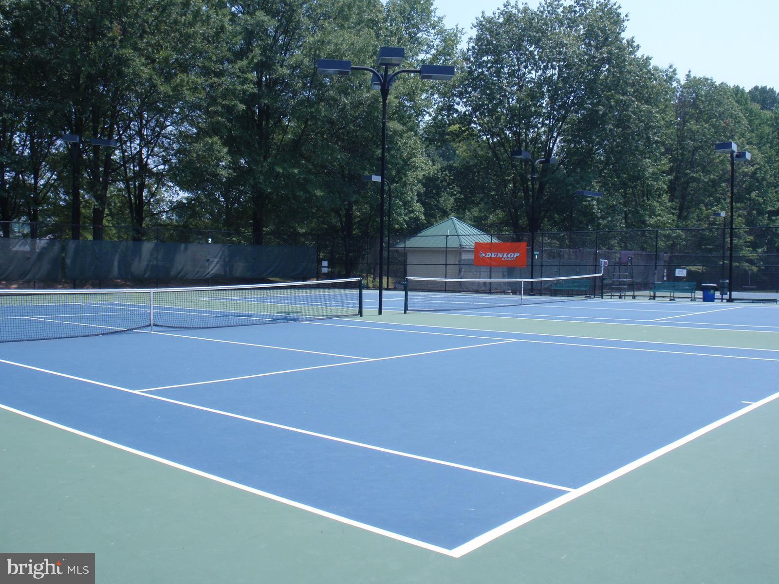 1537 Church Hill Place, Unit 1537 Reston, VA 20194 - Photo 31 of 40 a tennis court that has tennis net