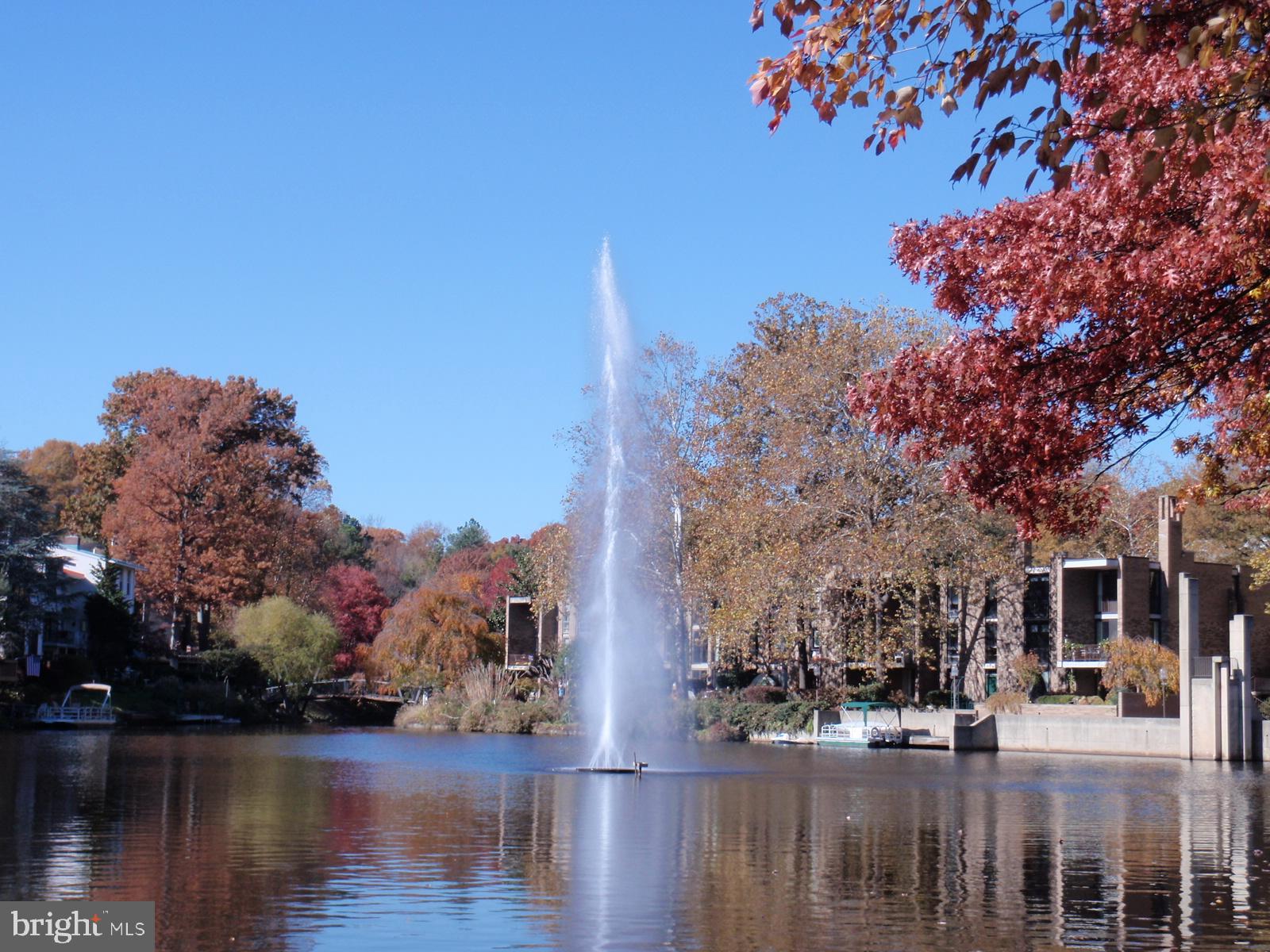 1537 Church Hill Place, Unit 1537 Reston, VA 20194 - Photo 33 of 40 a view of a lake with a building in the background