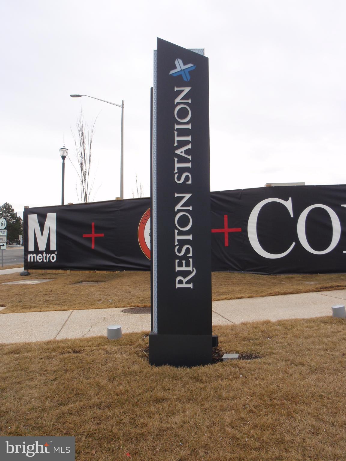 1537 Church Hill Place, Unit 1537 Reston, VA 20194 - Photo 39 of 40 a view of a bench sitting in the middle of a building