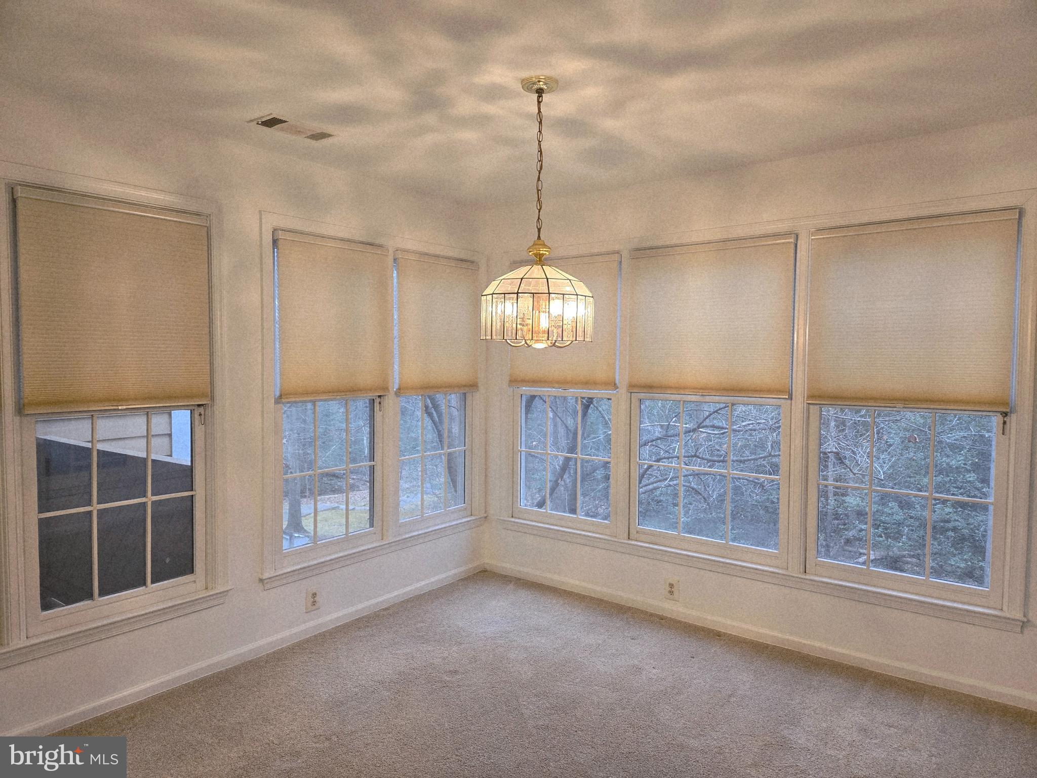 1537 Church Hill Place, Unit 1537 Reston, VA 20194 - Photo 7 of 40 a view of an empty room with a window