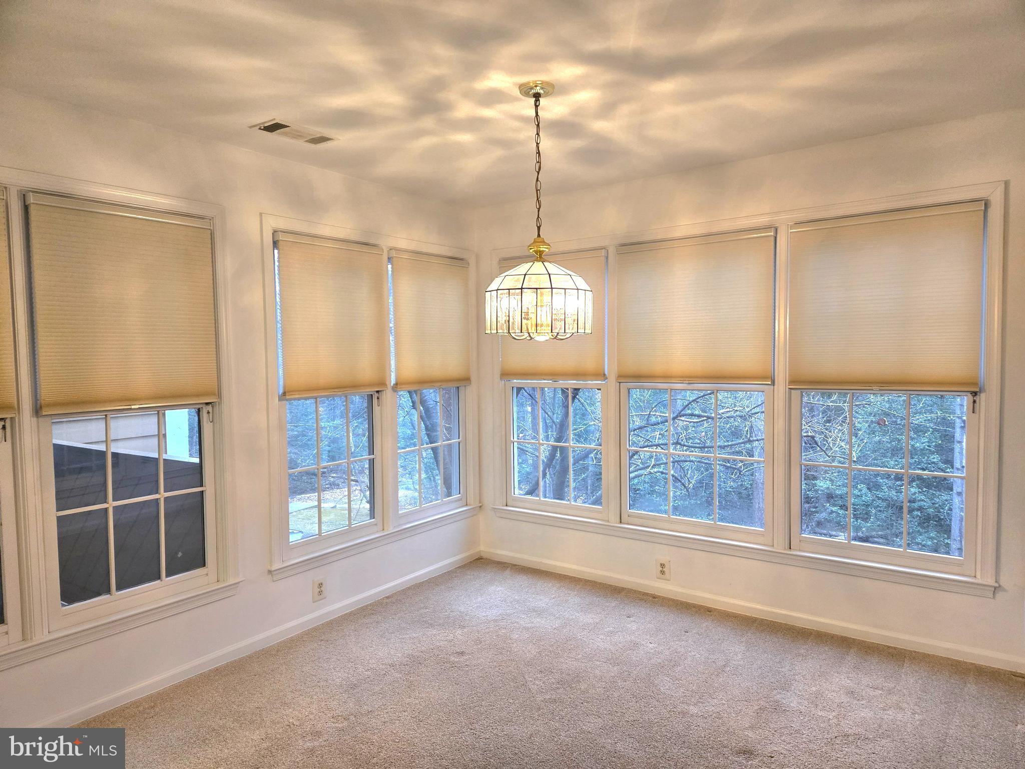 1537 Church Hill Place, Unit 1537 Reston, VA 20194 - Photo 8 of 40 a view of an empty room with a window
