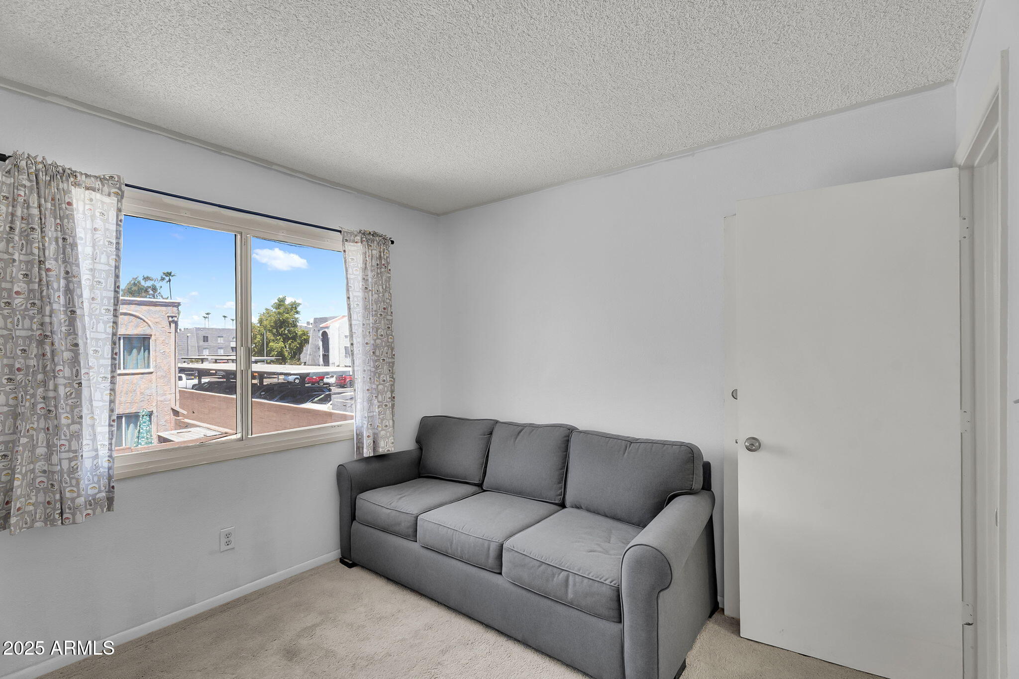 600 South Dobson Road, Unit 6 Mesa, AZ 85202 - Photo 13 of 21 a living room with furniture and a large window