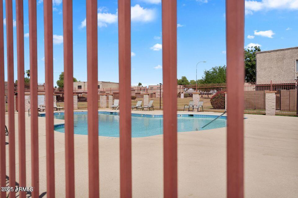 600 South Dobson Road, Unit 6 Mesa, AZ 85202 - Photo 19 of 21 a view of balcony with floor to ceiling window and wooden fence