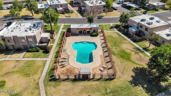 an aerial view of a house with a swimming pool