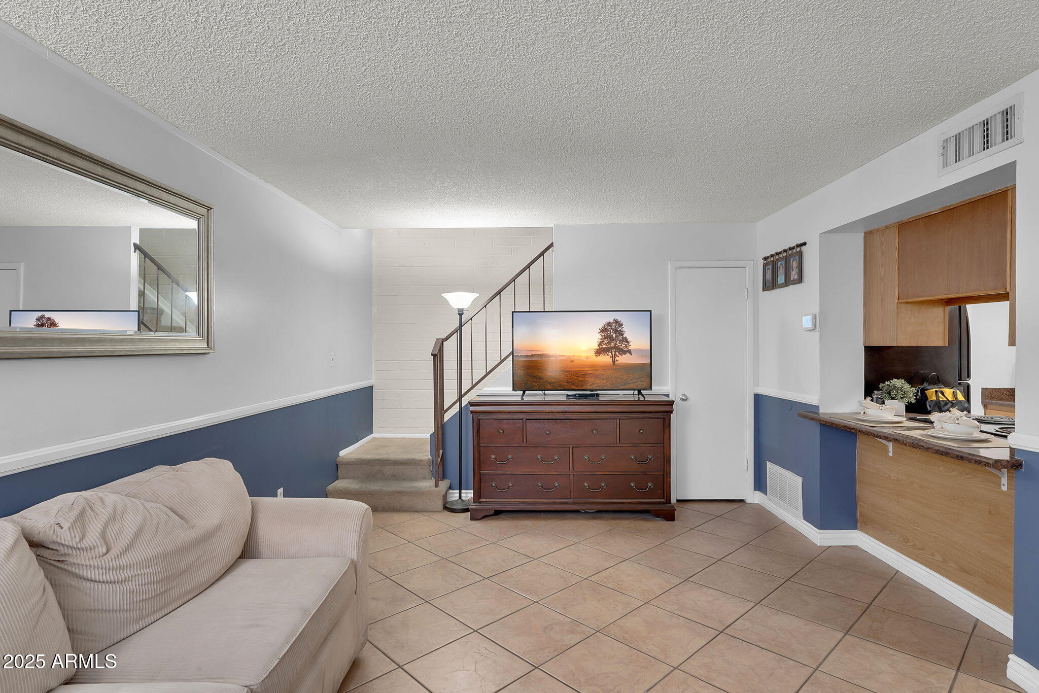 600 South Dobson Road, Unit 6 Mesa, AZ 85202 - Photo 3 of 21 a living room with furniture and a flat screen tv