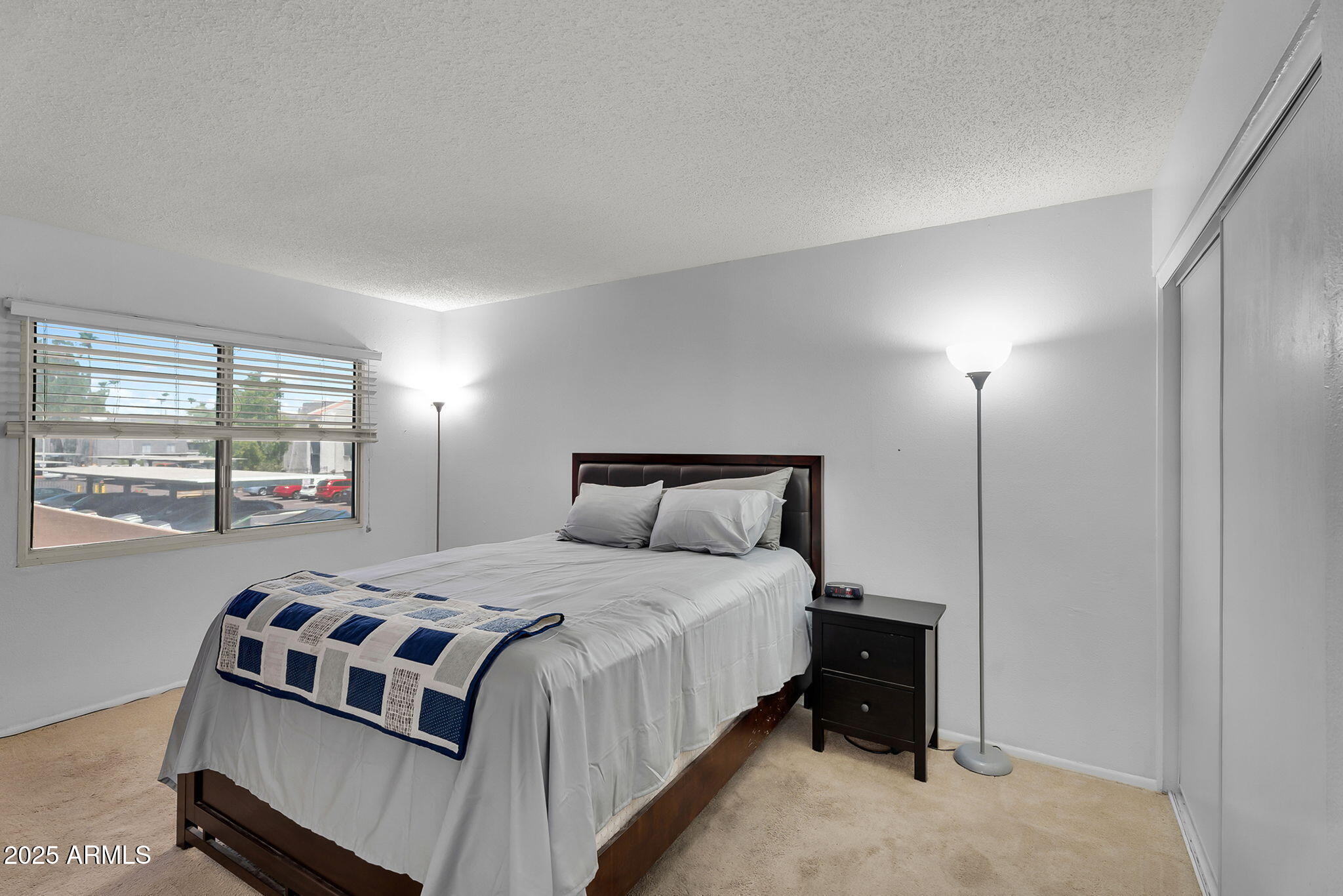 600 South Dobson Road, Unit 6 Mesa, AZ 85202 - Photo 8 of 21 a bedroom with a bed and a window