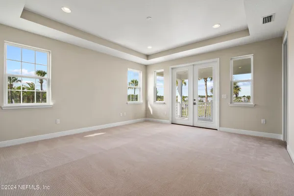 a view of an empty room with glass door
