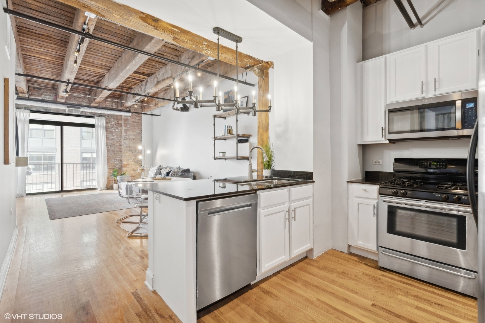 106 North Aberdeen Street, Unit 5G Chicago, IL 60607 - Photo 10 of 21 a kitchen with stainless steel appliances granite countertop a stove and a sink