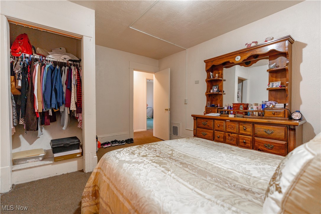 900 4th Street Southwest Canton, OH 44707 - Photo 17 of 31 Bedroom with a closet and carpet