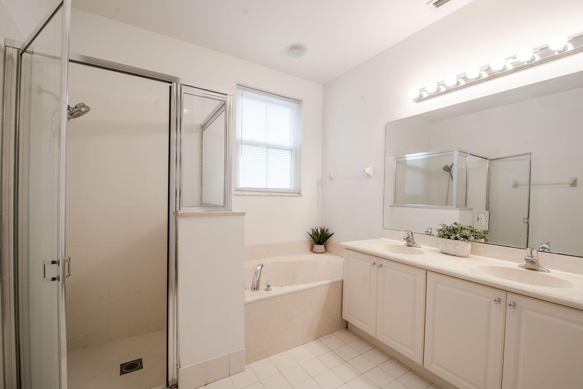 1484 Frederick Small Road Jupiter, FL 33458 - Photo 12 of 19 a bathroom with a double vanity sink mirror double and shower