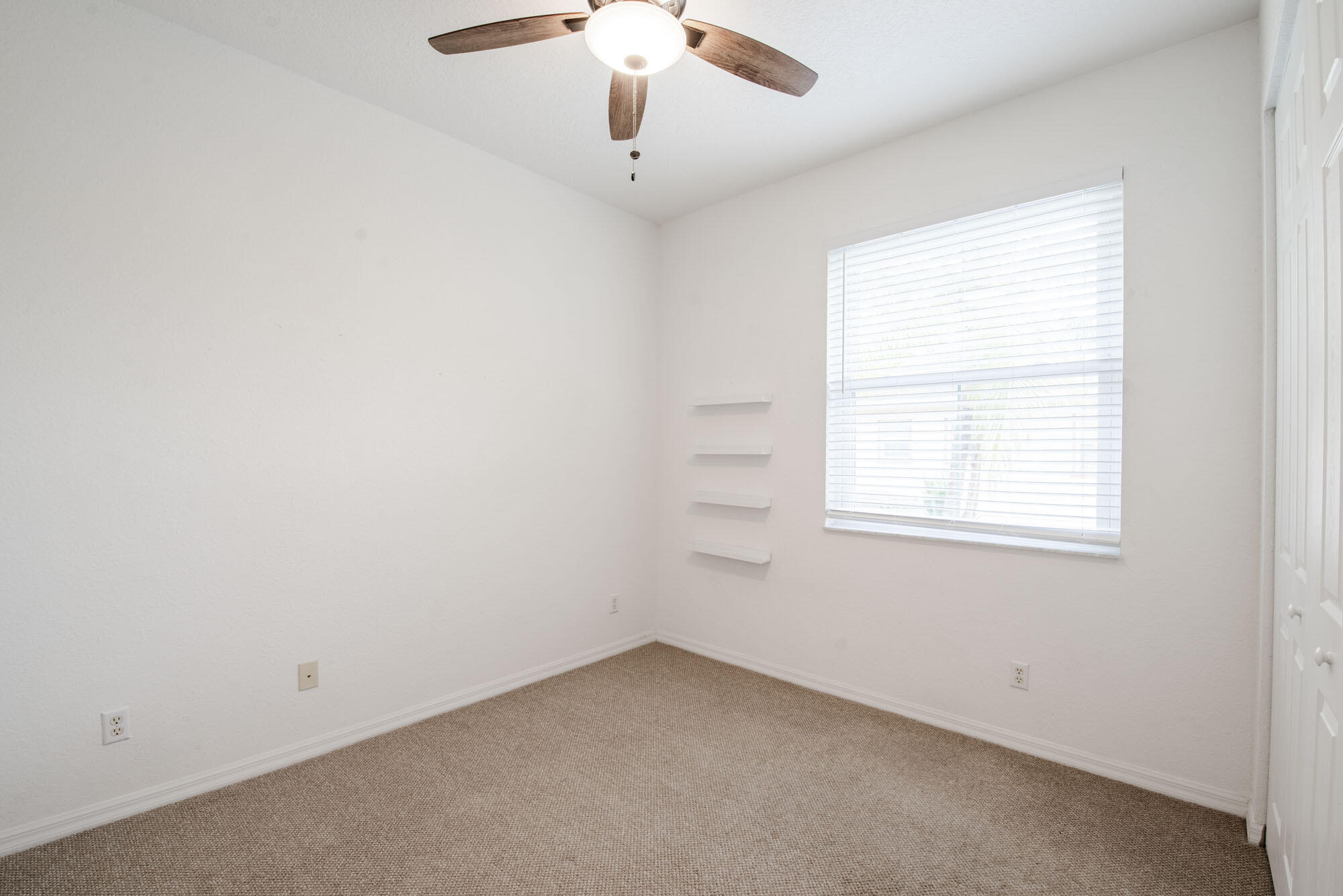 1484 Frederick Small Road Jupiter, FL 33458 - Photo 13 of 19 an empty room with a window