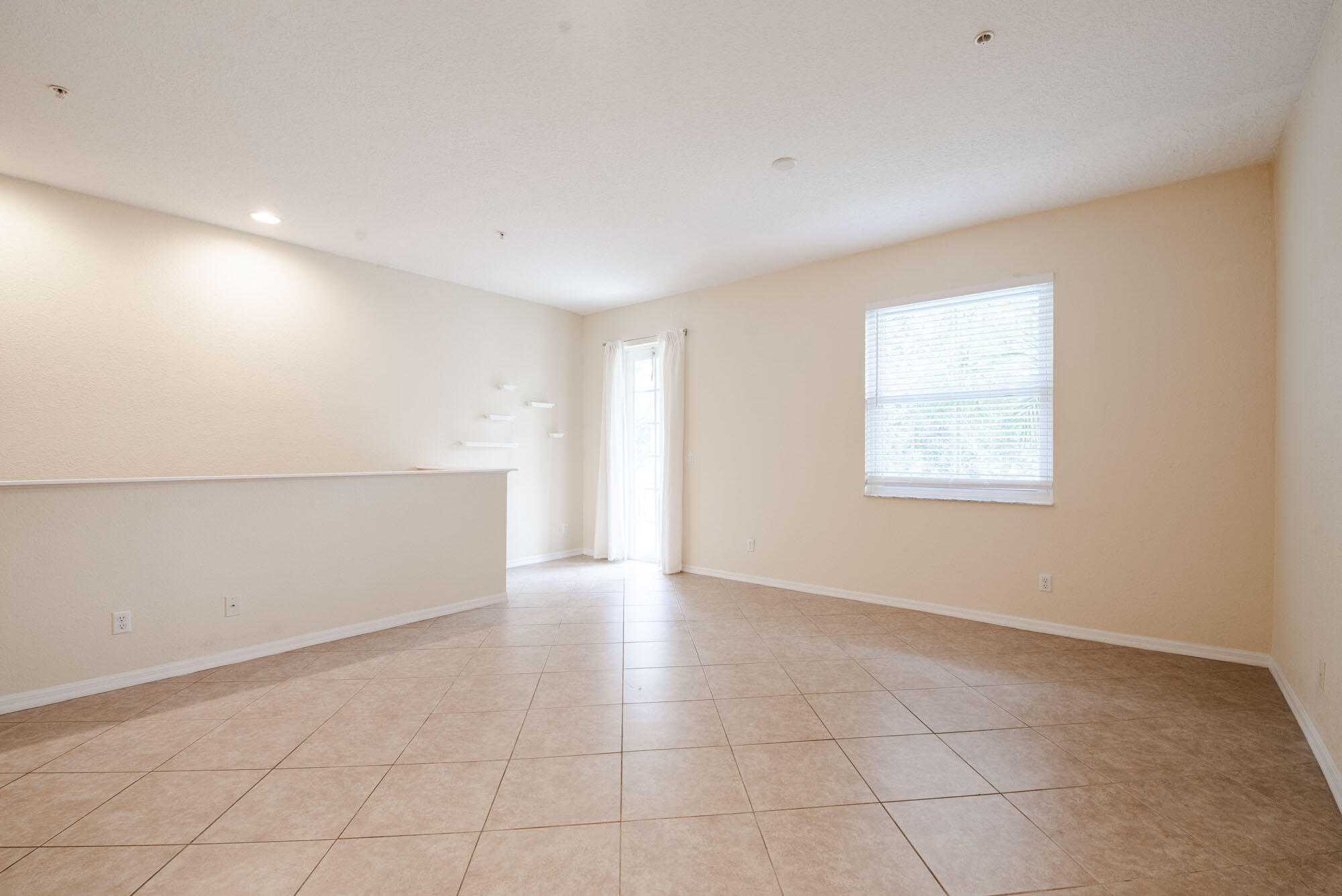 1484 Frederick Small Road Jupiter, FL 33458 - Photo 4 of 19 an empty room with a empty space and window