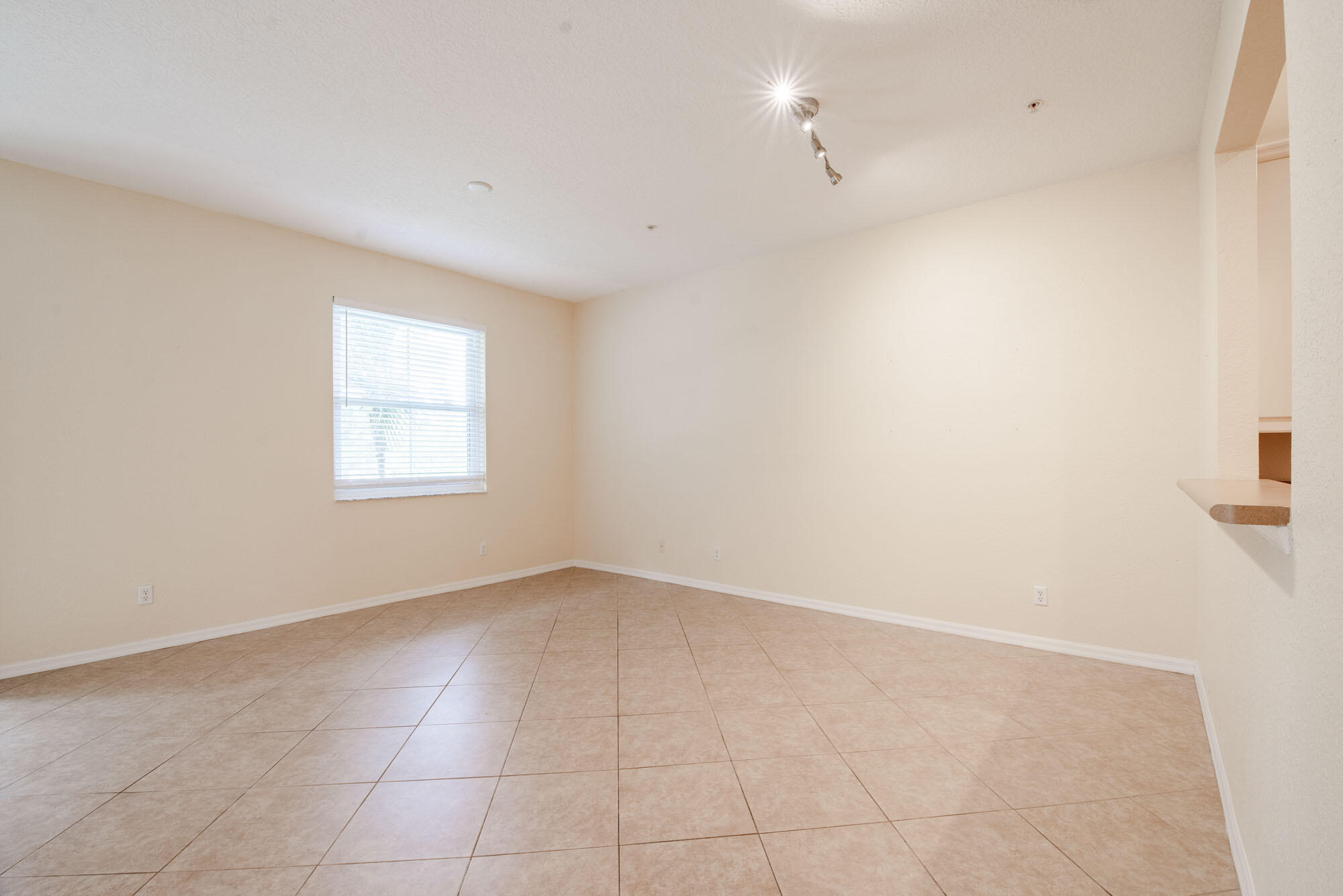 1484 Frederick Small Road Jupiter, FL 33458 - Photo 6 of 19 an empty room with windows