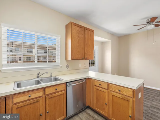 a kitchen with a refrigerator and cabinets