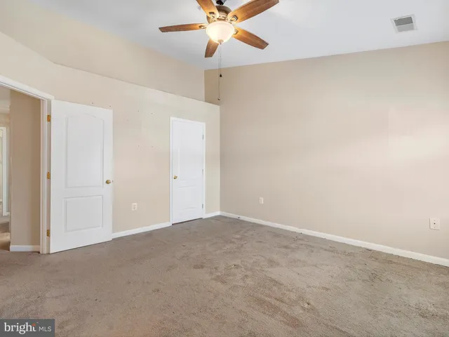 a bathroom with a toilet sink and shower