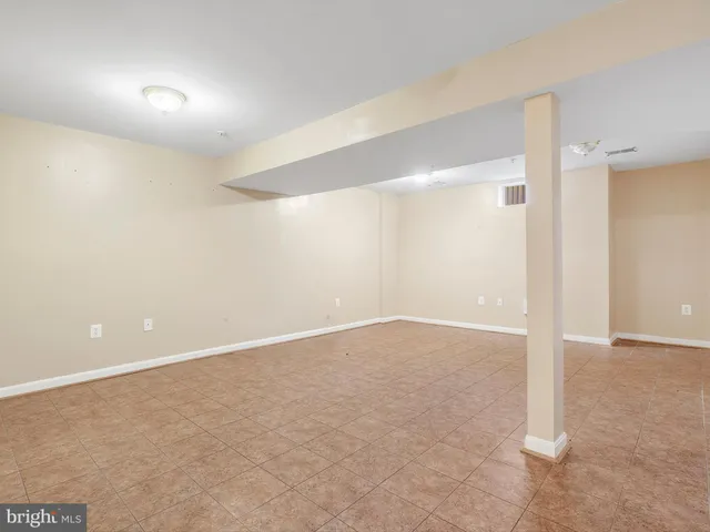 a kitchen with refrigerator and window