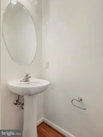 a bathroom with a sink and mirror