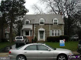 31 Fairview Road Springfield, PA 19064 - Photo 1 of 1 a front view of a house with a garden and parking