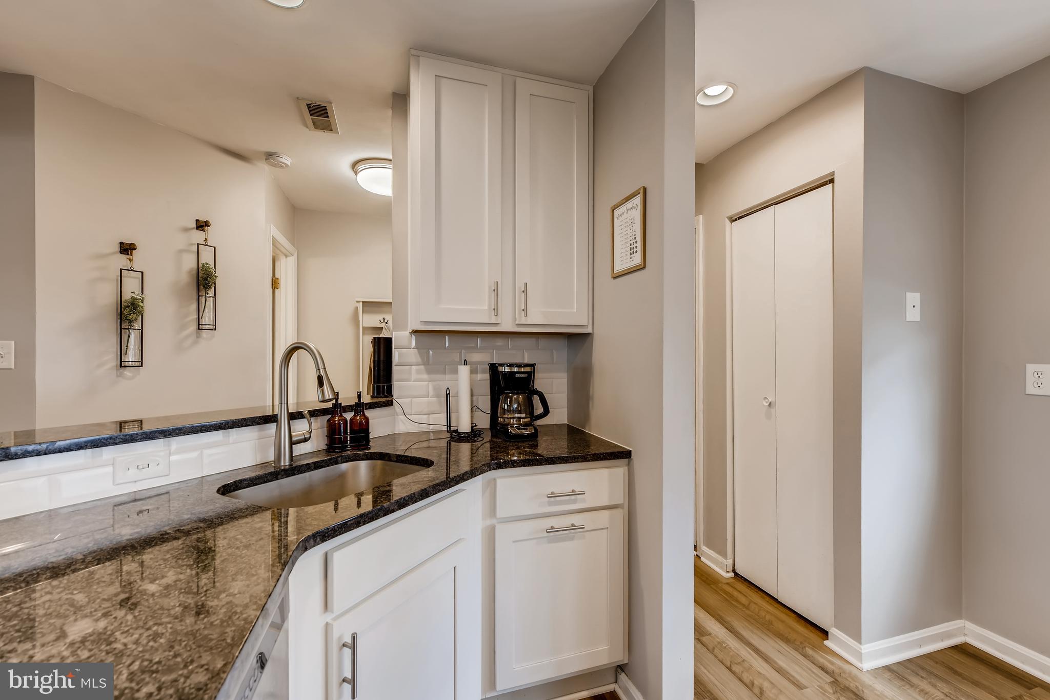 1625 Hilltop Road Edgewater, MD 21037 - Photo 13 of 38 a kitchen with stainless steel appliances granite countertop a sink a stove and a refrigerator