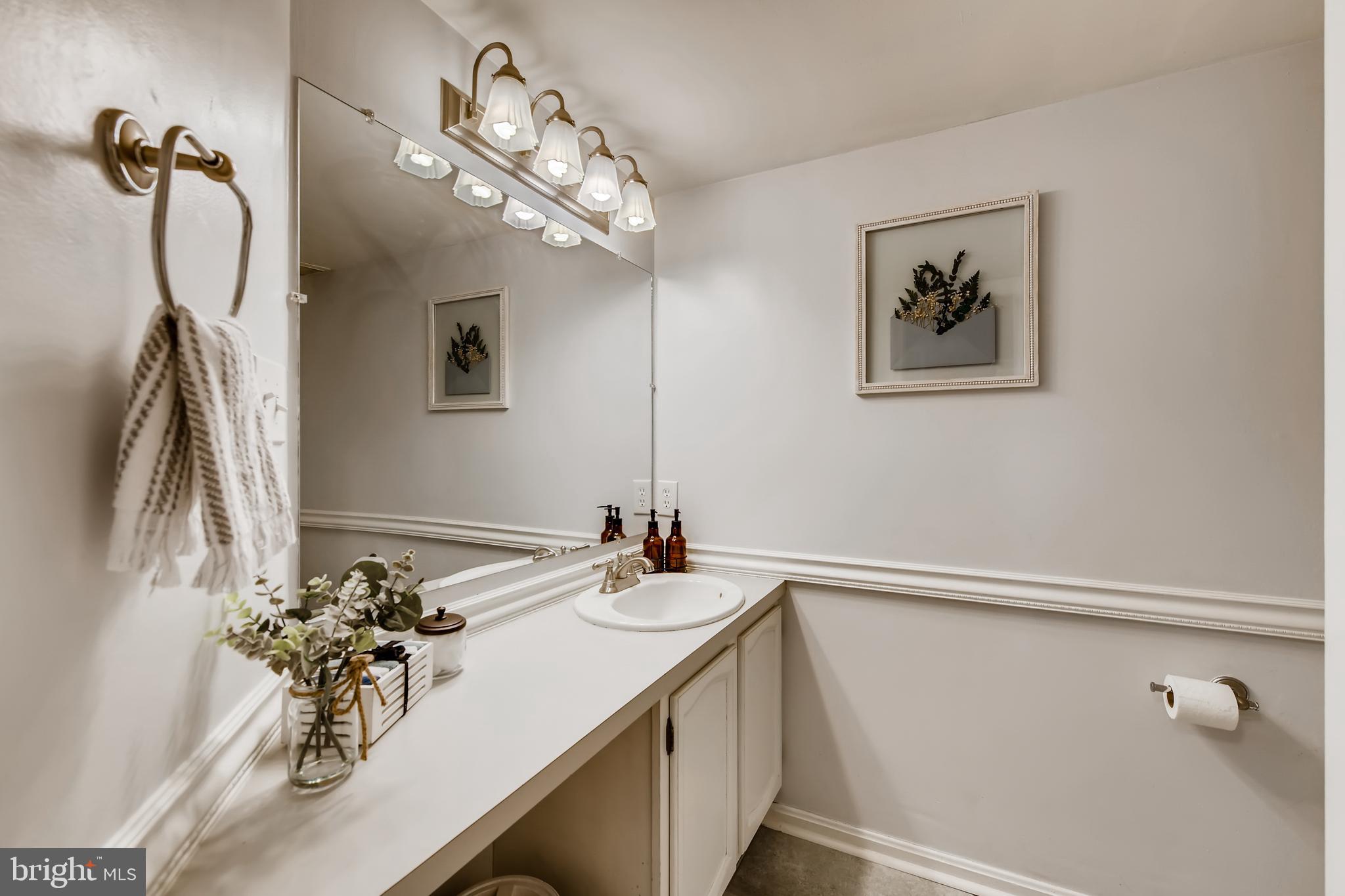 1625 Hilltop Road Edgewater, MD 21037 - Photo 15 of 38 a bathroom with a sink vanity and a mirror
