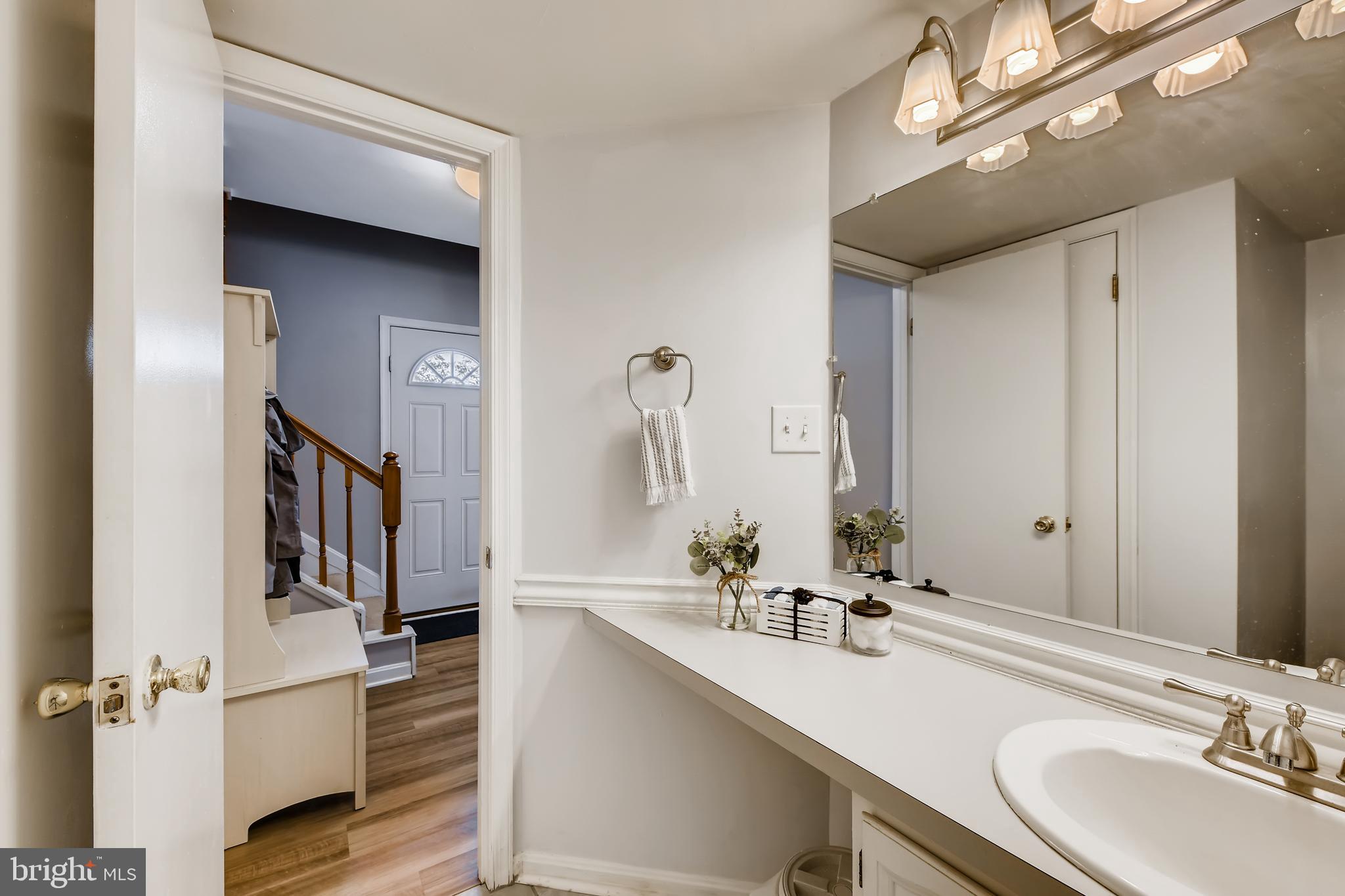 1625 Hilltop Road Edgewater, MD 21037 - Photo 16 of 38 a bathroom with a sink double vanity and a mirror
