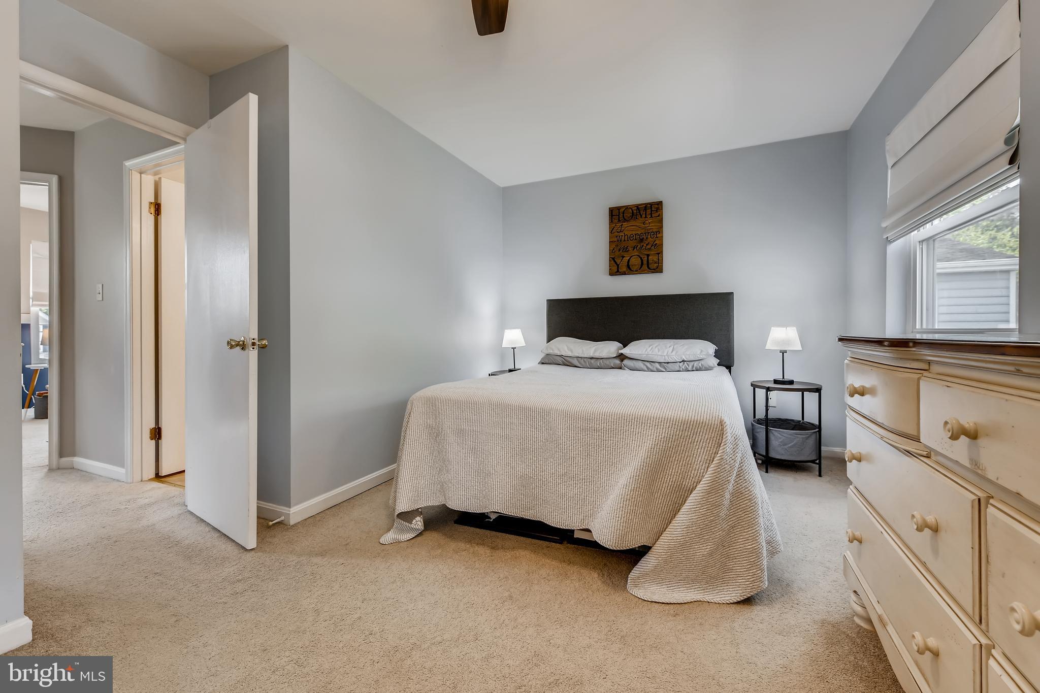1625 Hilltop Road Edgewater, MD 21037 - Photo 17 of 38 a spacious bedroom with a bed and a cabinets