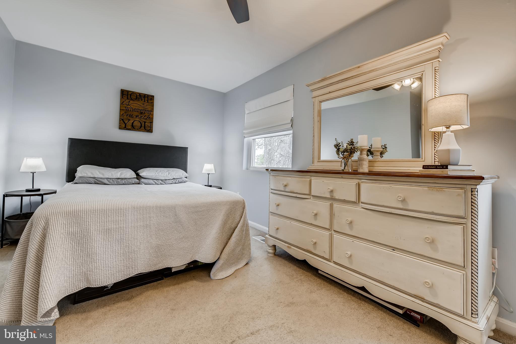 1625 Hilltop Road Edgewater, MD 21037 - Photo 18 of 38 a bedroom with a bed and a dresser