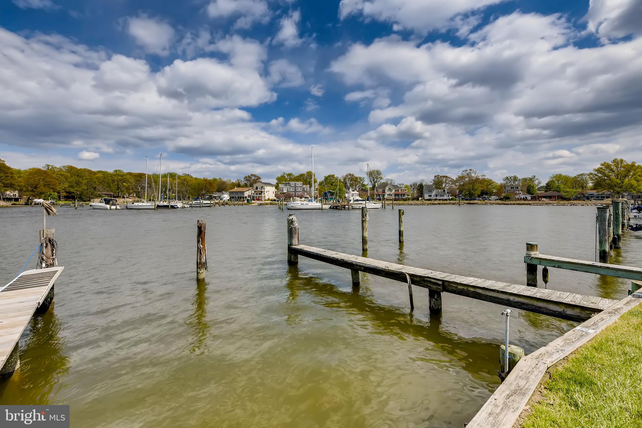1625 Hilltop Road Edgewater, MD 21037 - Photo 28 of 38 a view of a lake with a table and chairs in the back