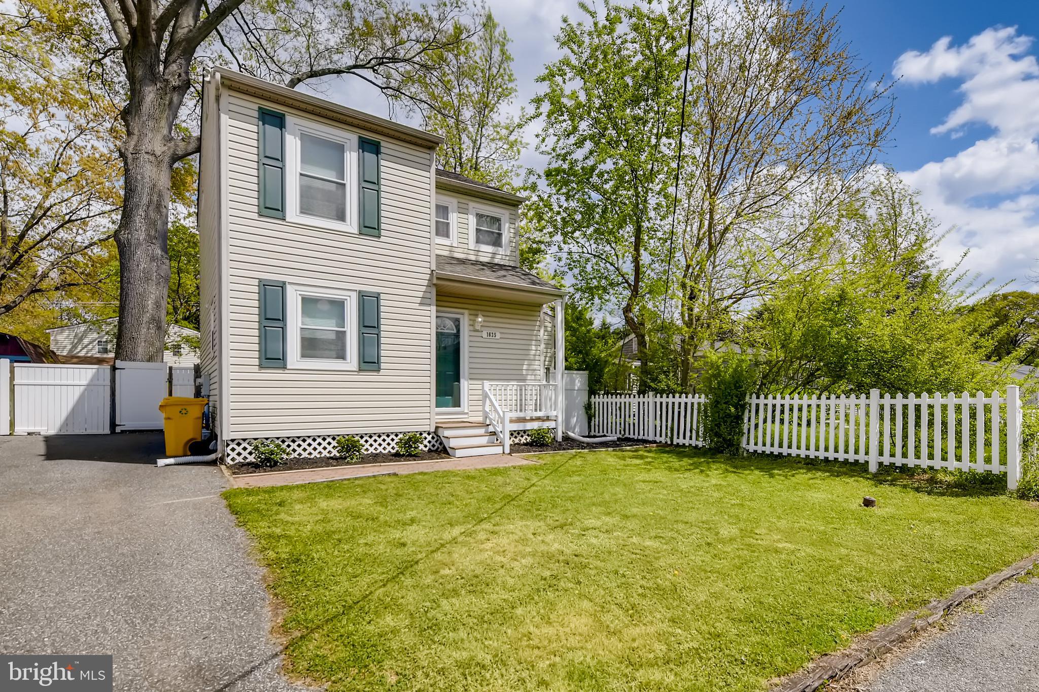 1625 Hilltop Road Edgewater, MD 21037 - Photo 30 of 38 a front view of a house with a garden and yard