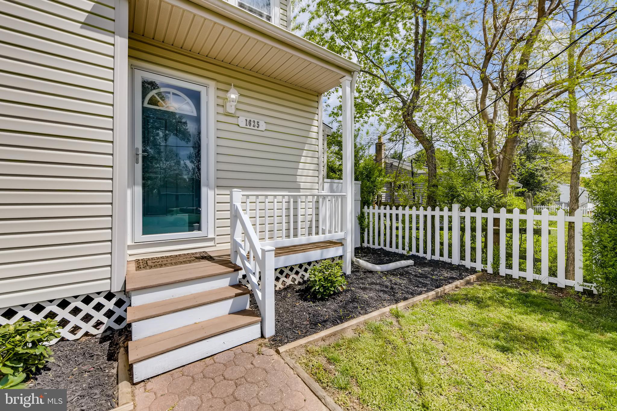 1625 Hilltop Road Edgewater, MD 21037 - Photo 32 of 38 a front view of a house with a garden