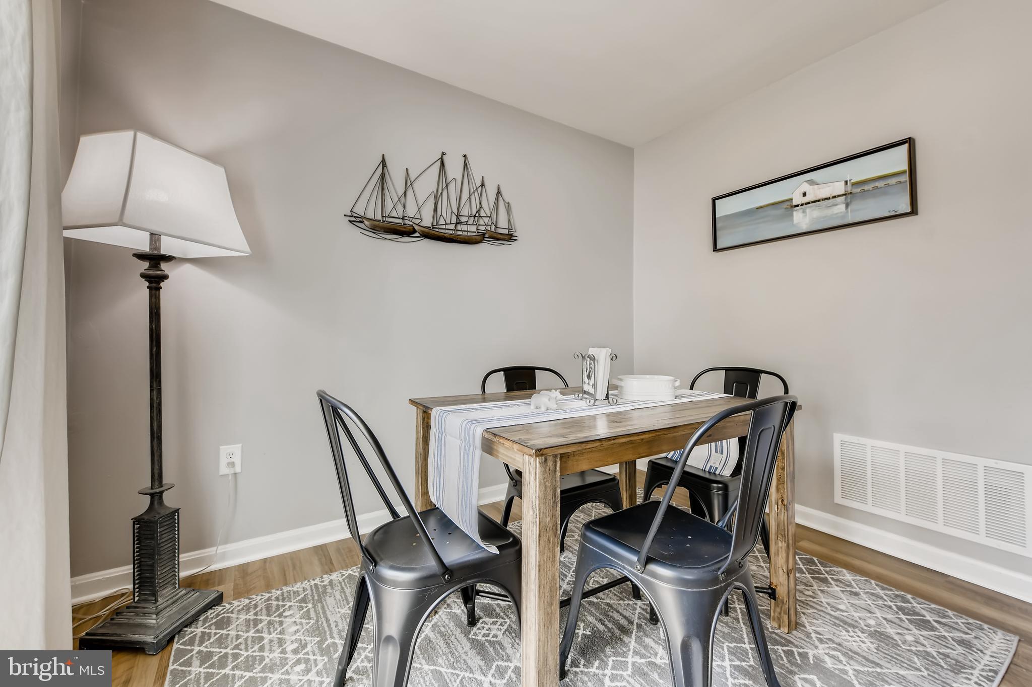 1625 Hilltop Road Edgewater, MD 21037 - Photo 8 of 38 a view of a dining room with furniture and wooden floor